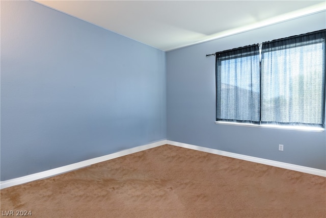 carpeted empty room with plenty of natural light