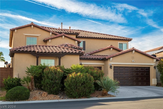 mediterranean / spanish-style house featuring a garage