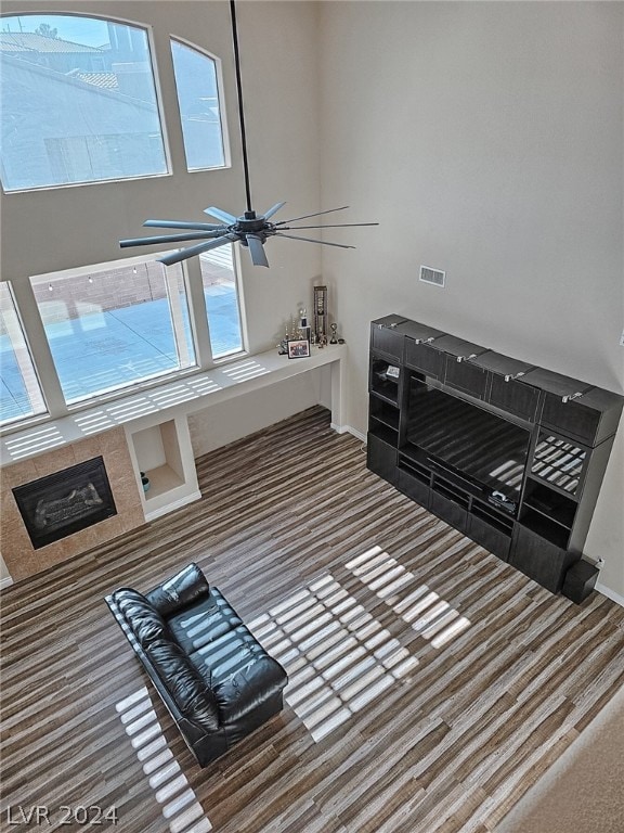 living room featuring ceiling fan and plenty of natural light