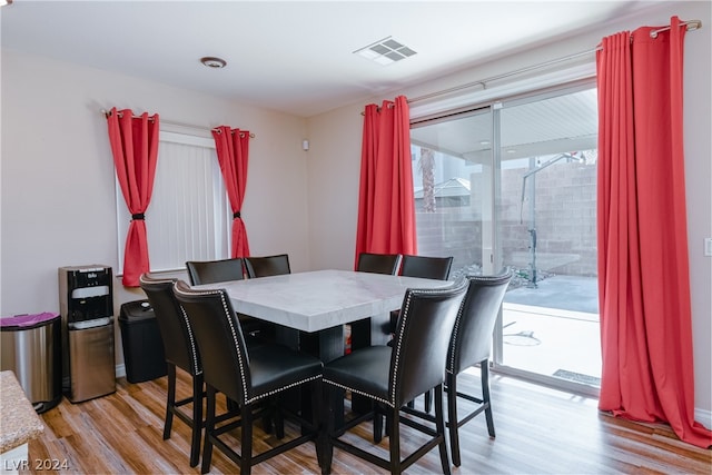 dining space with light wood-type flooring