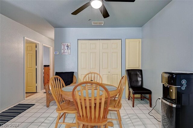 dining space with ceiling fan and light tile patterned floors