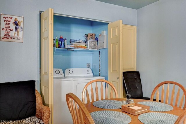 dining space with washer and clothes dryer