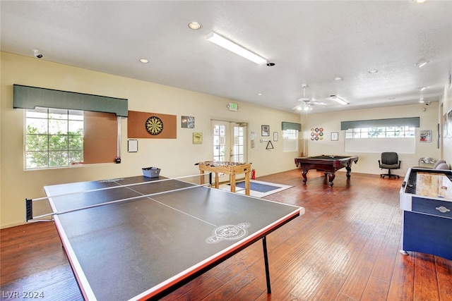 playroom with a healthy amount of sunlight, ceiling fan, billiards, and dark hardwood / wood-style flooring