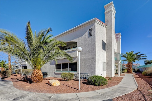 view of side of property featuring stucco siding