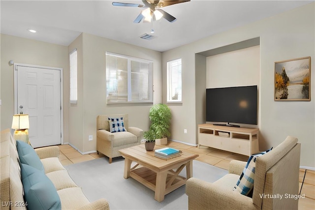 living room featuring ceiling fan and light tile patterned flooring