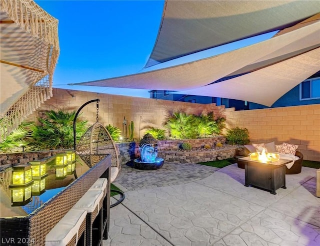 view of patio / terrace with an outdoor fire pit