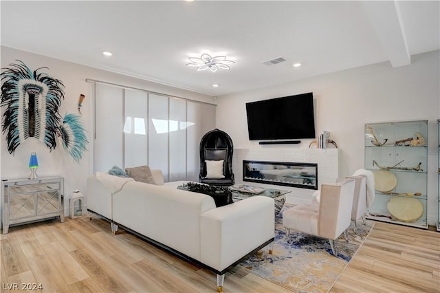 living room with light hardwood / wood-style flooring