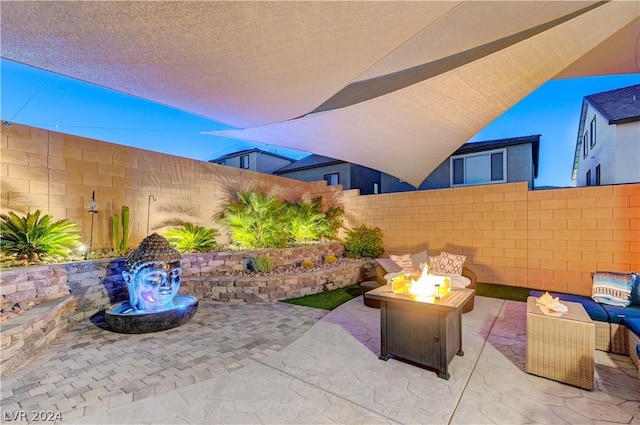 view of patio / terrace with an outdoor fire pit