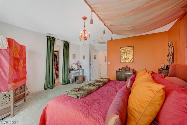 carpeted bedroom featuring a chandelier