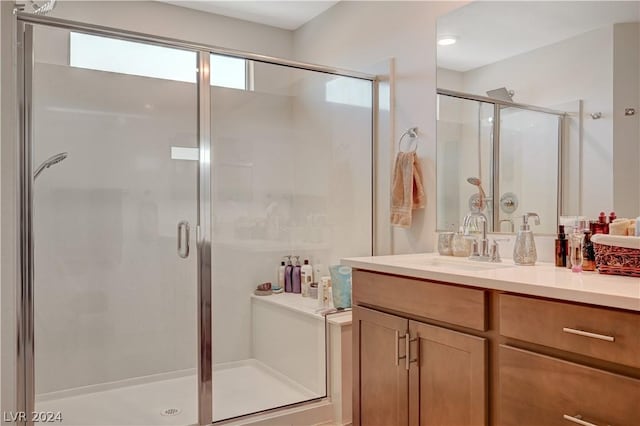 bathroom with vanity and an enclosed shower