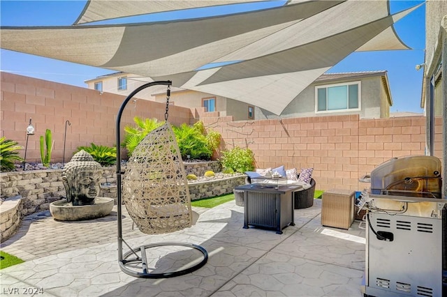 view of patio with an outdoor fire pit