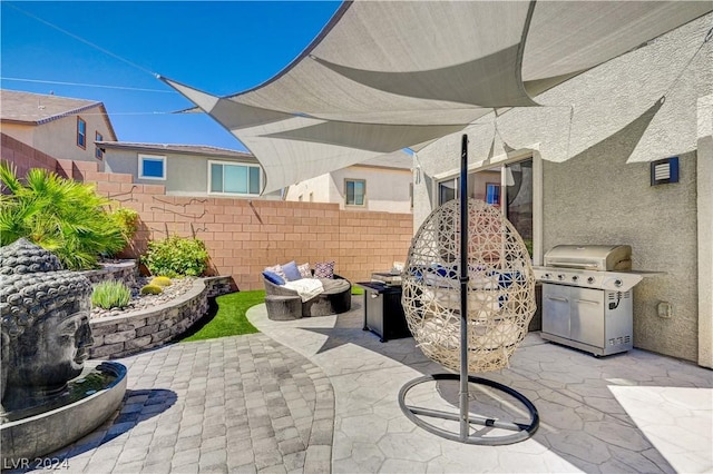 view of patio with an outdoor living space and area for grilling