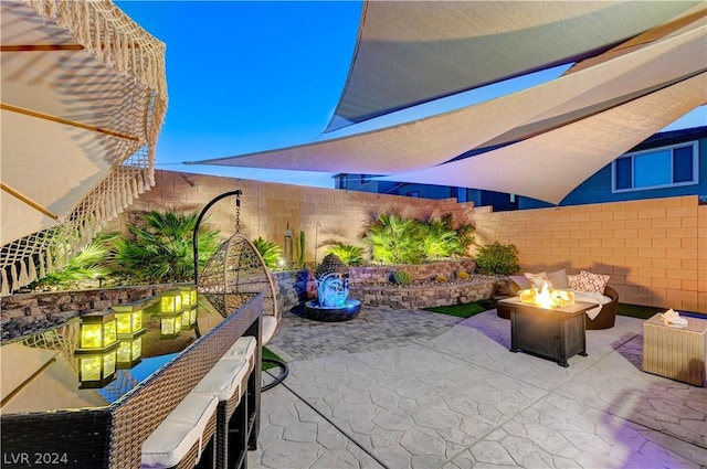 view of patio / terrace featuring a fire pit