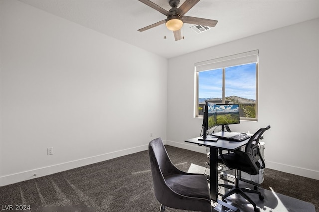 carpeted office featuring ceiling fan