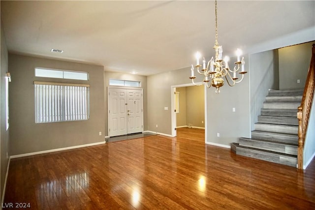 interior space featuring hardwood / wood-style floors and a chandelier