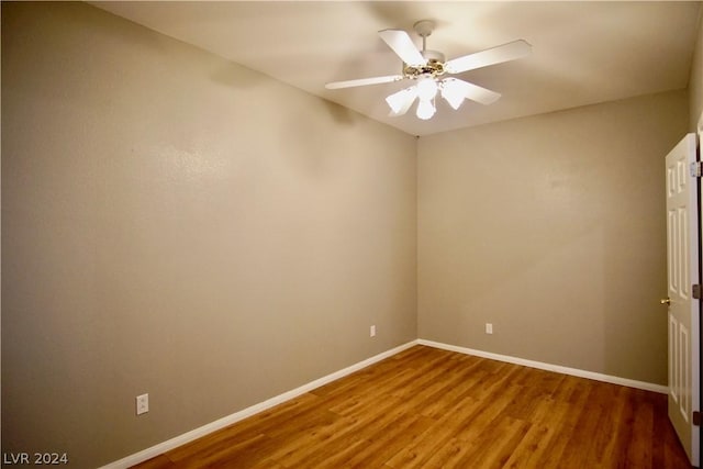 spare room featuring hardwood / wood-style flooring and ceiling fan