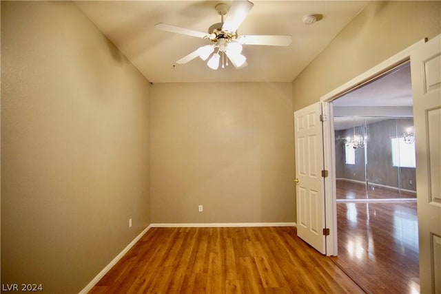 empty room featuring wood-type flooring and ceiling fan