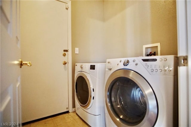 laundry room featuring washing machine and dryer