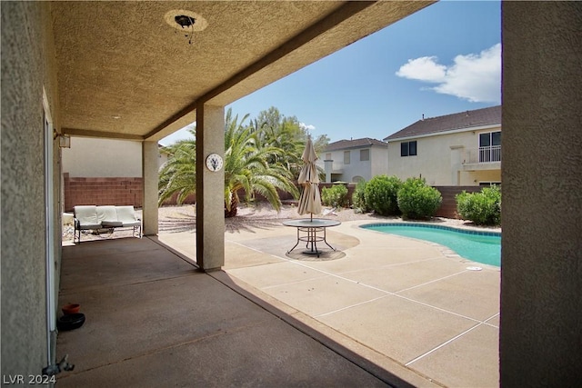 view of swimming pool featuring a patio area