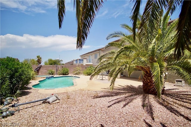 view of swimming pool with an in ground hot tub and a patio area