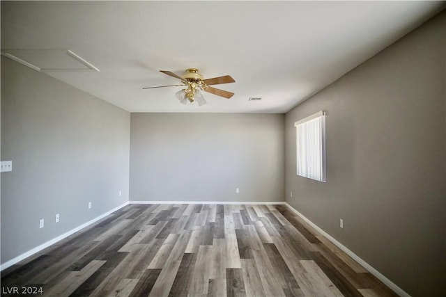 unfurnished room featuring ceiling fan and dark hardwood / wood-style floors