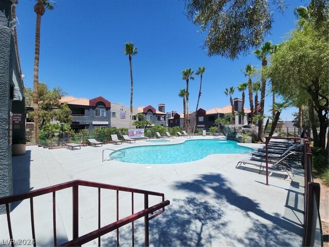 view of swimming pool with a patio