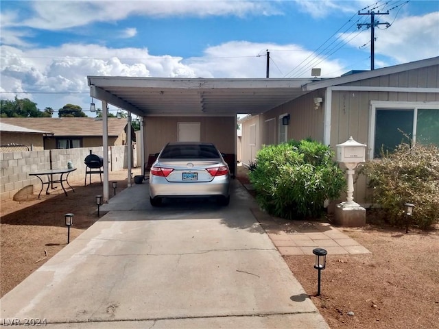 view of vehicle parking featuring a carport