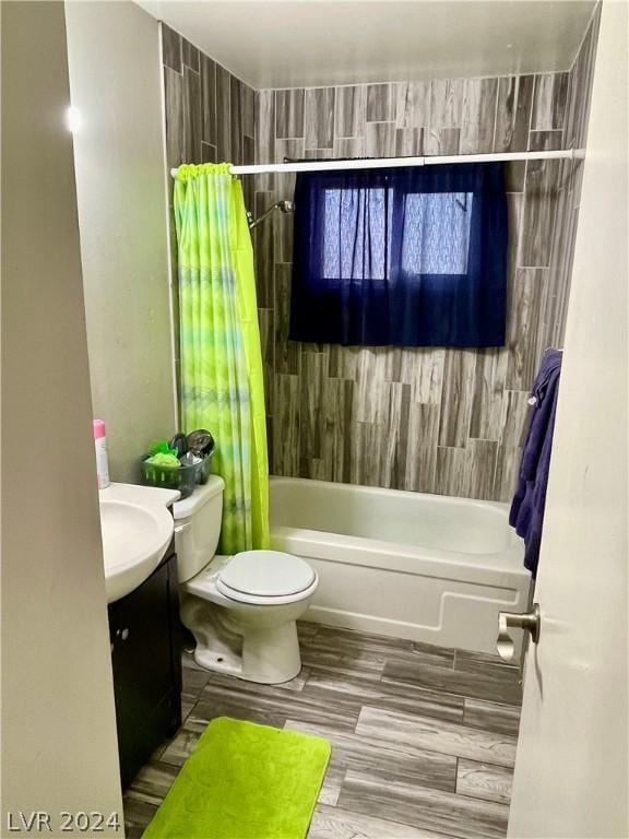 full bathroom featuring vanity, shower / bathtub combination with curtain, and toilet