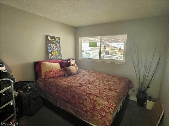 bedroom featuring a textured ceiling