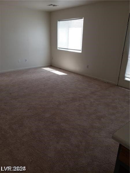 spare room with carpet flooring