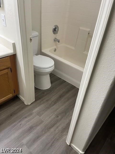 full bathroom with vanity, hardwood / wood-style flooring, and toilet