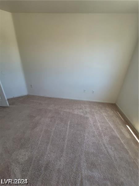 unfurnished room featuring carpet flooring