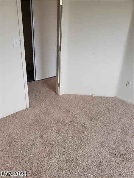 spare room with light colored carpet