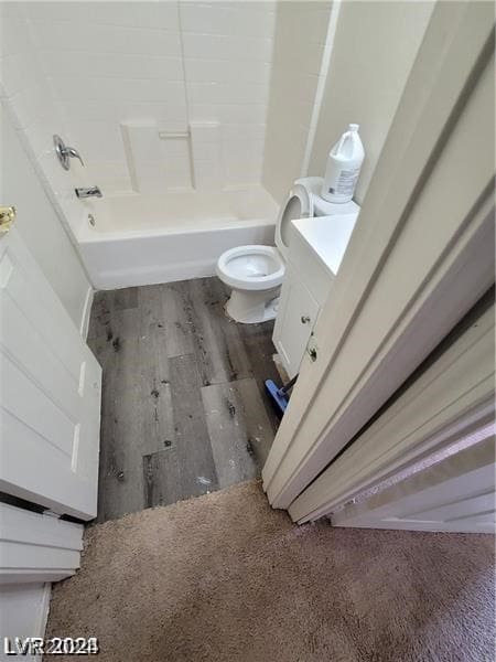 full bathroom featuring wood-type flooring, toilet, vanity, and tub / shower combination