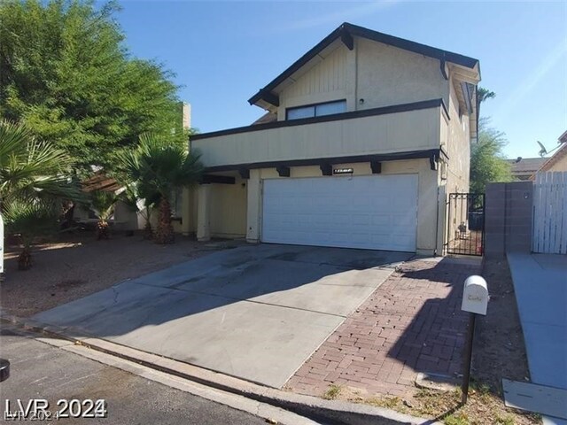 front facade with a garage