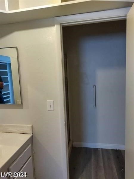 bathroom featuring vanity and wood-type flooring