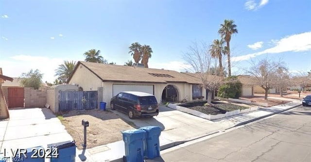 ranch-style home featuring a garage