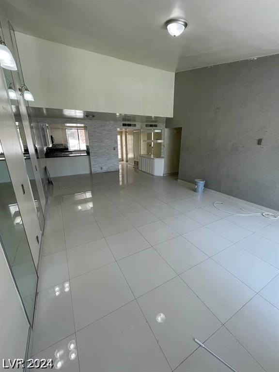 kitchen with hanging light fixtures and light tile patterned floors