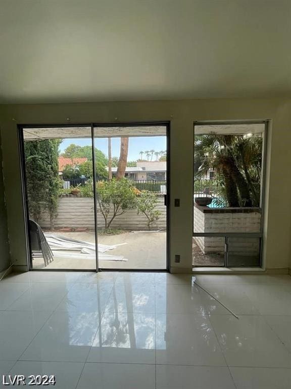 doorway featuring light tile patterned floors