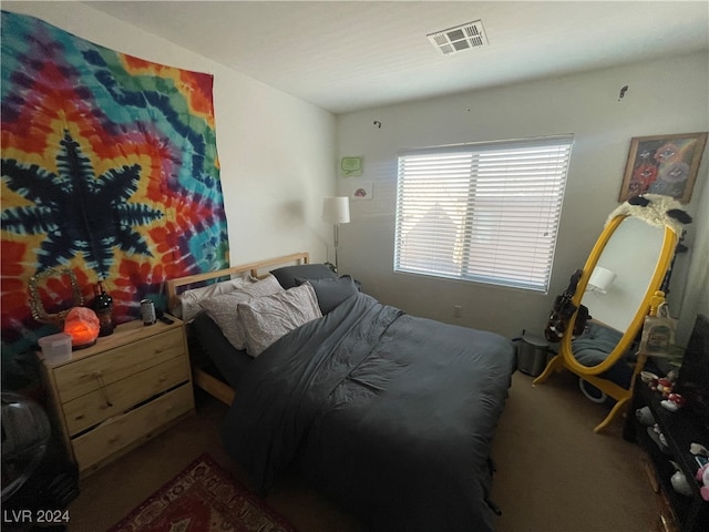 bedroom featuring visible vents and carpet flooring