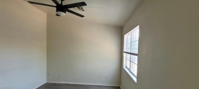 empty room with a wealth of natural light and ceiling fan