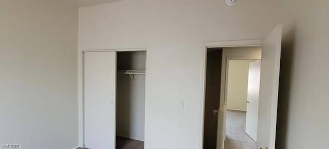 unfurnished bedroom with a closet