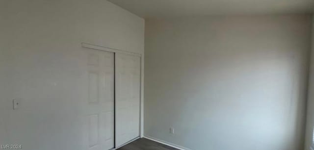 unfurnished bedroom with a closet