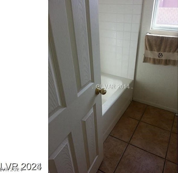 bathroom with tile patterned flooring