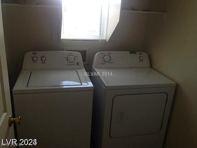 washroom featuring washing machine and dryer