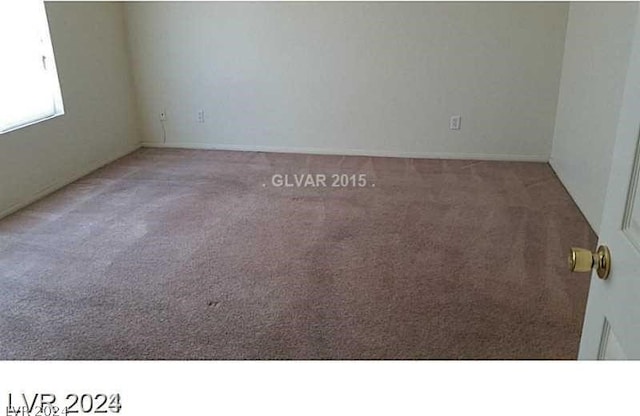 empty room featuring light colored carpet