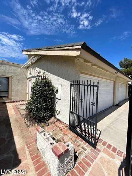 view of side of property with a garage