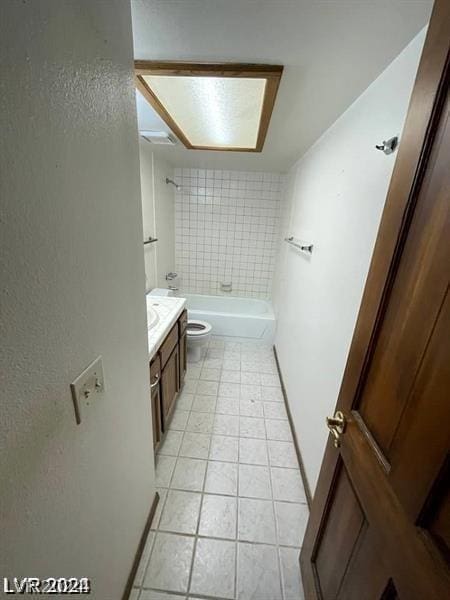 bathroom featuring vanity, tile patterned floors, and toilet