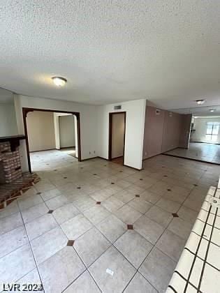 empty room with a textured ceiling