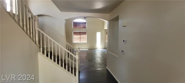 interior space featuring a towering ceiling